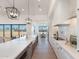 Bright kitchen featuring an island with bar seating, stainless steel appliances, and modern finishes at 2095 N 77Th Pl, Mesa, AZ 85207