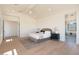 Large main bedroom featuring hardwood floors, high ceilings, and abundant natural light at 2095 N 77Th Pl, Mesa, AZ 85207