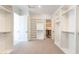 A spacious walk-in closet boasts ample shelving, providing abundant storage and organization capabilities at 2095 N 77Th Pl, Mesa, AZ 85207