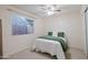 Simple and comfortable bedroom with a ceiling fan, closet, and a window with blinds at 21061 N 33Rd Dr, Phoenix, AZ 85027