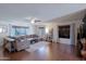 Spacious living room with hard surface floors, a ceiling fan, and multiple windows at 21061 N 33Rd Dr, Phoenix, AZ 85027