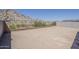 Spacious, undeveloped backyard with wrought iron and block fence offers mountain views and plenty of space for landscaping at 21276 W Mariposa St, Buckeye, AZ 85396