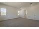 Bedroom with plush carpet, natural light, and ensuite access at 21276 W Mariposa St, Buckeye, AZ 85396