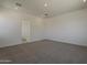 Neutral carpeted bedroom with crisp white walls and recessed lighting at 21276 W Mariposa St, Buckeye, AZ 85396