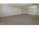 Upstairs bonus room with neutral carpet, windows, and recessed lighting at 21276 W Mariposa St, Buckeye, AZ 85396
