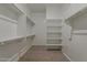 Walk-in closet with custom shelving and ample storage space at 21276 W Mariposa St, Buckeye, AZ 85396