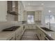 Charming kitchen featuring bright cabinets, modern appliances, and a stylish island at 21276 W Mariposa St, Buckeye, AZ 85396