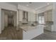 Large kitchen features an island, white cabinetry, stainless appliances, and recessed lighting at 21276 W Mariposa St, Buckeye, AZ 85396