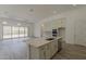 Gorgeous kitchen with island, stainless steel appliances, and a seamless flow to the living area at 21276 W Mariposa St, Buckeye, AZ 85396