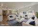 Bright, open living space with contemporary furnishings, recessed lighting, and seamless access to the kitchen at 21276 W Mariposa St, Buckeye, AZ 85396