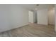 Bright living room boasts wood floors, neutral paint and recessed lighting at 21276 W Mariposa St, Buckeye, AZ 85396