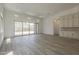Bright, open living room featuring wood floors and sliding doors to outdoor views at 21276 W Mariposa St, Buckeye, AZ 85396