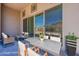 Covered patio with elegant seating, a modern table, and a mountain view at 21276 W Mariposa St, Buckeye, AZ 85396
