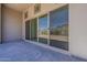 Covered patio with sliding glass doors offering access to the backyard and stunning mountain views at 21276 W Mariposa St, Buckeye, AZ 85396