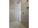 Neutral-toned tiled shower with glass door and modern fixtures at 21276 W Mariposa St, Buckeye, AZ 85396