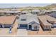An aerial view of the home showing its paved driveway and landscaping at 21427 W Meadowbrook Ave, Buckeye, AZ 85396