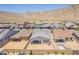 Desert homes featuring tile roofs and block wall fencing, backing to open space at 21427 W Meadowbrook Ave, Buckeye, AZ 85396