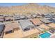 Aerial view of a neighborhood of homes with pools and desert landscaping at 21427 W Meadowbrook Ave, Buckeye, AZ 85396
