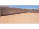 A view of the backyard area enclosed with a tall block wall for privacy at 21427 W Meadowbrook Ave, Buckeye, AZ 85396