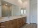 Bathroom features double sinks, quartz counters, and a glass shower at 21427 W Meadowbrook Ave, Buckeye, AZ 85396