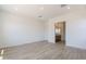 Bright bedroom featuring tile flooring and an ensuite bathroom at 21427 W Meadowbrook Ave, Buckeye, AZ 85396