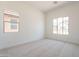 Bright bedroom with carpeted floors, recessed lighting, and dual windows at 21427 W Meadowbrook Ave, Buckeye, AZ 85396