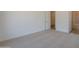 Bedroom featuring plush carpeting, neutral walls, and easy access to the bathroom at 21427 W Meadowbrook Ave, Buckeye, AZ 85396