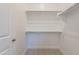 Walk-in closet with dual-level metal clothing rods at 21427 W Meadowbrook Ave, Buckeye, AZ 85396