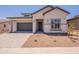 Well-maintained single-story home features a two-car garage and desert landscaping in a residential neighborhood at 21427 W Meadowbrook Ave, Buckeye, AZ 85396