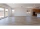 Well-lit living space boasting an open layout with a view of the kitchen and backyard at 21427 W Meadowbrook Ave, Buckeye, AZ 85396