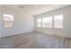 Bright living room with tile floors, recessed lighting, and multiple windows at 21427 W Meadowbrook Ave, Buckeye, AZ 85396