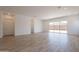 Open living area showcasing wood-style tile floors and an abundance of natural light at 21427 W Meadowbrook Ave, Buckeye, AZ 85396