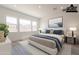 Staged bedroom with a plush bed, large windows, neutral tones, and modern decor for relaxation at 21427 W Meadowbrook Ave, Buckeye, AZ 85396