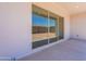 Covered patio features a concrete floor and sliding glass doors to the interior at 21427 W Meadowbrook Ave, Buckeye, AZ 85396