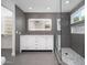 Bathroom features a white double vanity, lighted mirror, and glass shower at 21632 N 48Th St, Phoenix, AZ 85054