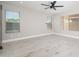 Bright bedroom featuring three windows and neutral-toned flooring at 21632 N 48Th St, Phoenix, AZ 85054