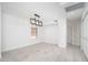 Bright bedroom with modern lighting, geometric accent wall, and wood-look tiled floor at 21632 N 48Th St, Phoenix, AZ 85054