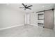 The spacious bedroom features neutral walls and floors with a sliding barn door to the bath at 21632 N 48Th St, Phoenix, AZ 85054
