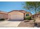 Charming single-story home featuring a two-car garage and low maintenance landscaping at 21632 N 48Th St, Phoenix, AZ 85054