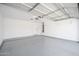 Spacious two-car garage featuring epoxy flooring, white walls, and an automatic door opener at 21632 N 48Th St, Phoenix, AZ 85054