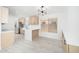 Modern kitchen with stainless steel appliances, quartz countertops, and a stylish eat-in island at 21632 N 48Th St, Phoenix, AZ 85054