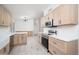 Bright kitchen featuring stainless steel appliances, light wood cabinets and white countertops at 21632 N 48Th St, Phoenix, AZ 85054