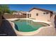 Tranquil backyard showcasing a sparkling pool with a patio and exterior views of the home at 21632 N 48Th St, Phoenix, AZ 85054