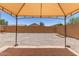 Spacious backyard featuring a covered patio area and low-maintenance gravel landscaping at 22547 W Pima St, Buckeye, AZ 85326