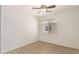Bedroom featuring light wood flooring, a ceiling fan, and a bright window at 22547 W Pima St, Buckeye, AZ 85326