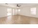 Spacious living room featuring wood-look floors, and access to outdoor living at 22547 W Pima St, Buckeye, AZ 85326