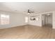 Open-concept living room with wood-look floors and natural light at 22547 W Pima St, Buckeye, AZ 85326