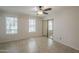 Spacious bedroom with tile floors, ceiling fan, and mirrored closet doors for ample storage at 2333 E Southern Ave # 1023, Tempe, AZ 85282
