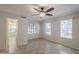 Well-lit bedroom with tile floors, ceiling fan, and multiple windows offering natural light at 2333 E Southern Ave # 1023, Tempe, AZ 85282