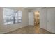 Bright bedroom with large window and bathroom access featuring neutral colors and tile flooring at 2333 E Southern Ave # 1023, Tempe, AZ 85282